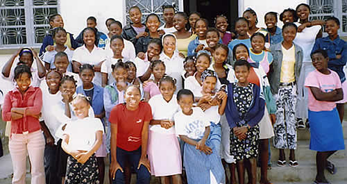 Children standing in front orphanage